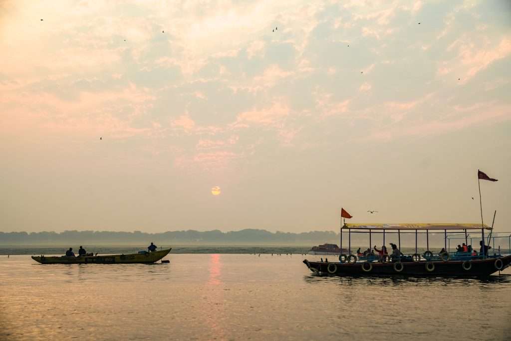 Boats at sunrise on the river Ganges in Varanasi 