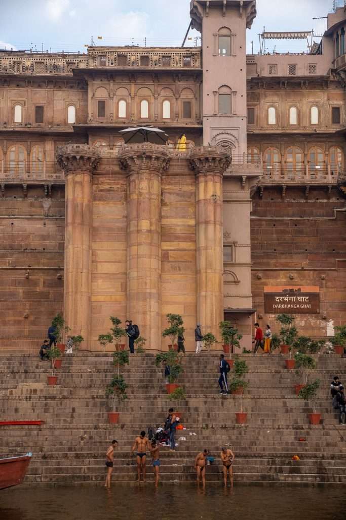 Men washing themselves in the river Ganges in Varanasi 