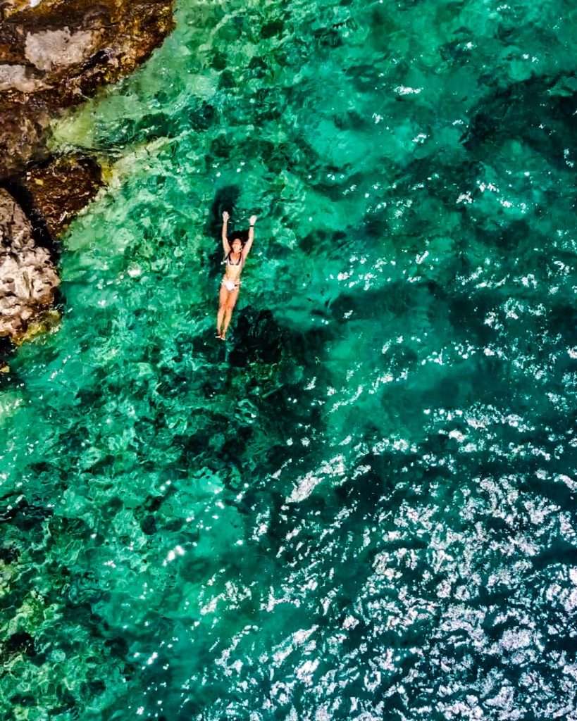 Woman floating in Adriatic Sea - Sipan Island, Dubrovnik